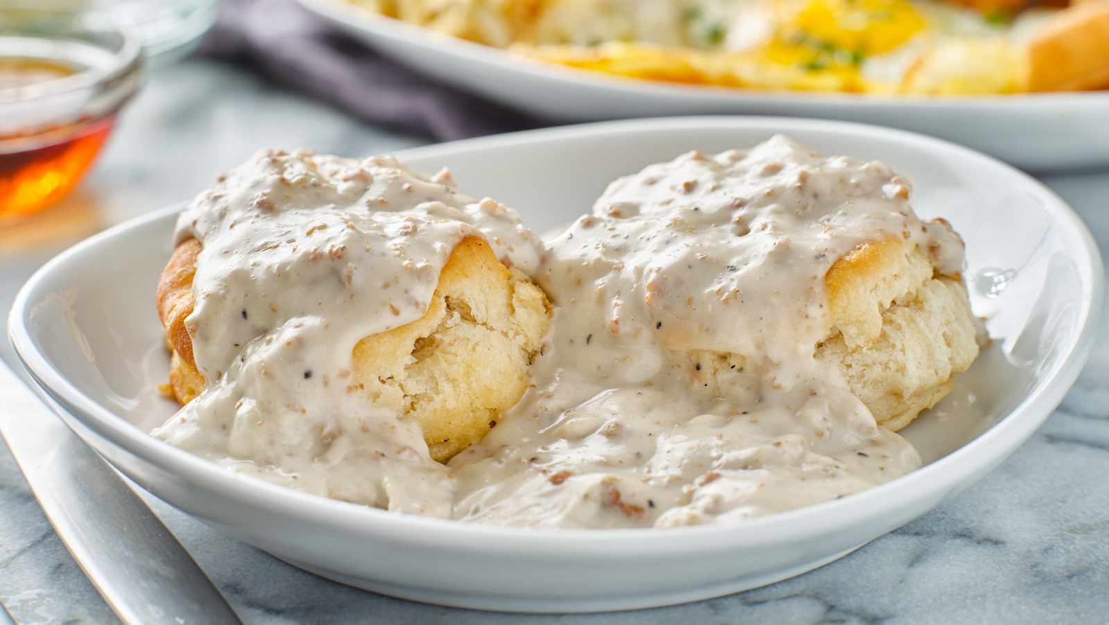 Why The Southern Sauce That Adorns Biscuits Is Called 'Sawmill Gravy'