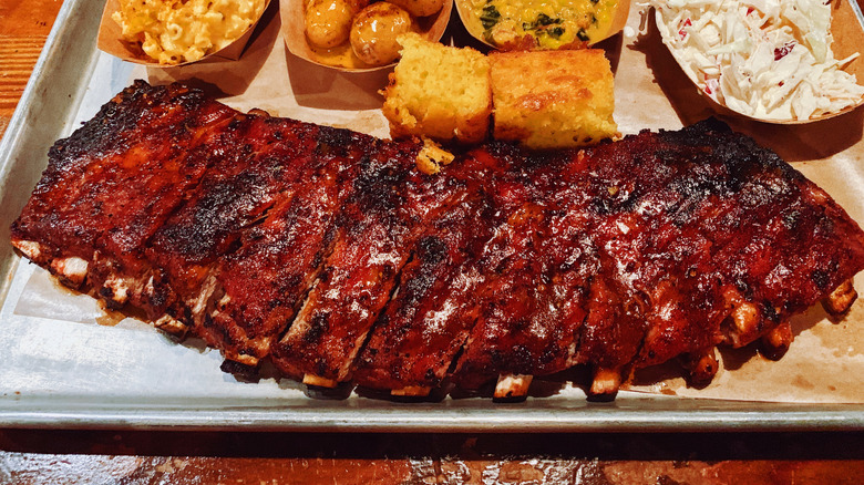BBQ ribs and sides on metal tray