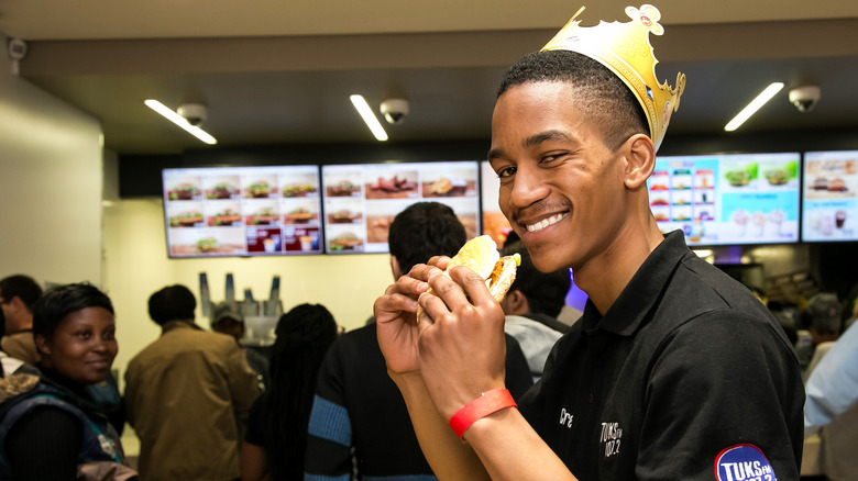 Customer eating burger at Burger King South Africa