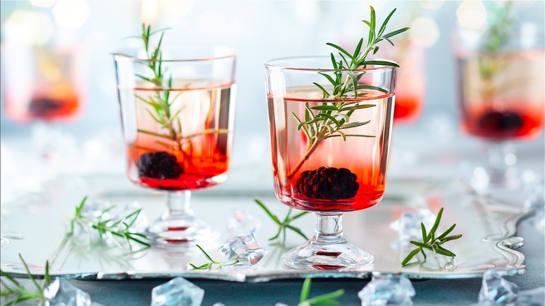 Holiday gin cocktails with rosemary and blackberry
