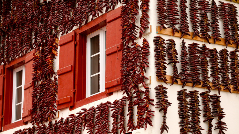 Espelette peppers hanging on house