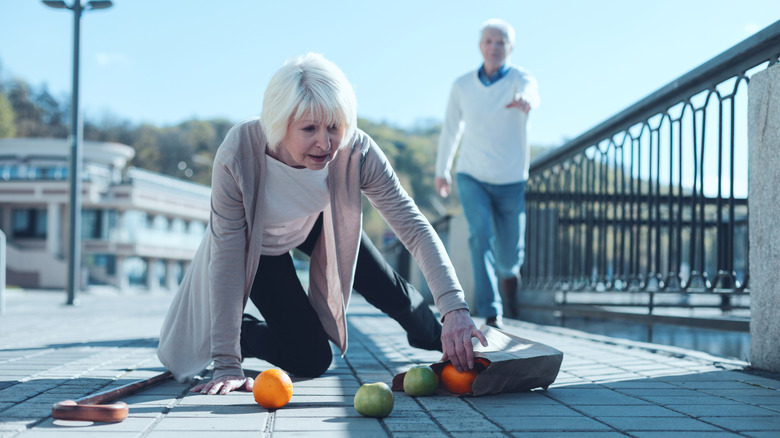 elderly couple dropped groceries