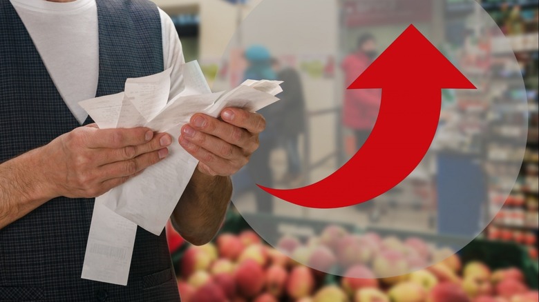 Man holding grocery receipts