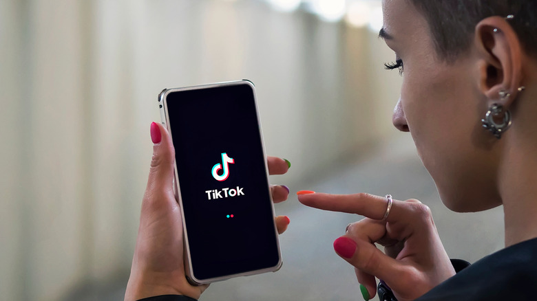 Person opening TikTok app