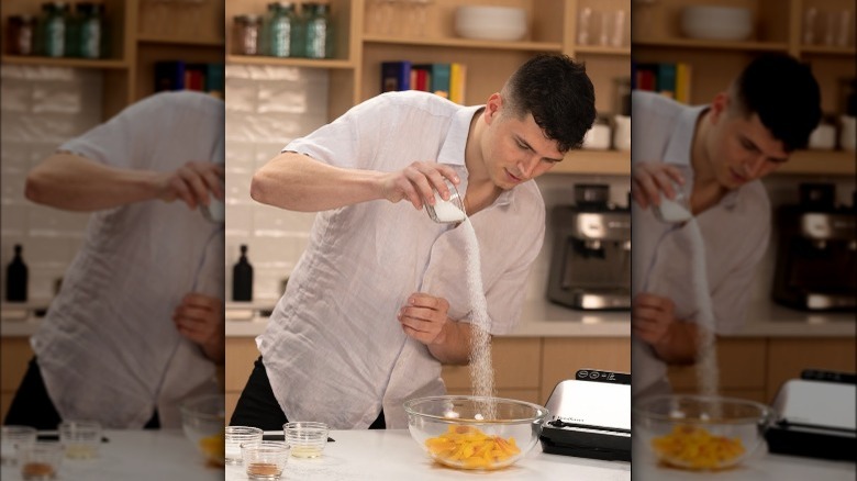 Nick DiGiovanni pouring ingredient