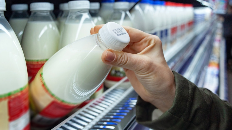 A person buying milk