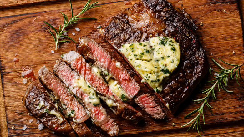 Seared ribeye steak eith butter on top