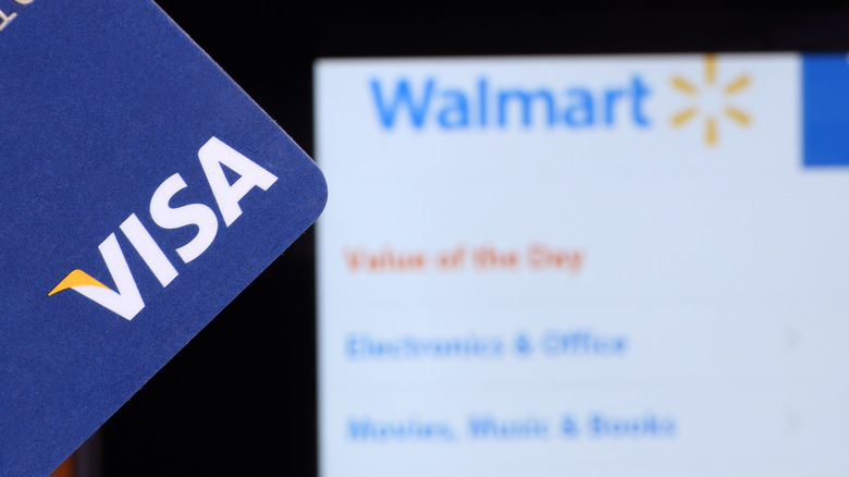 Visa card with Walmart screen in background