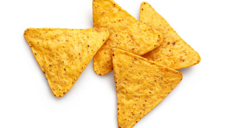 Four triangular corn chips.
