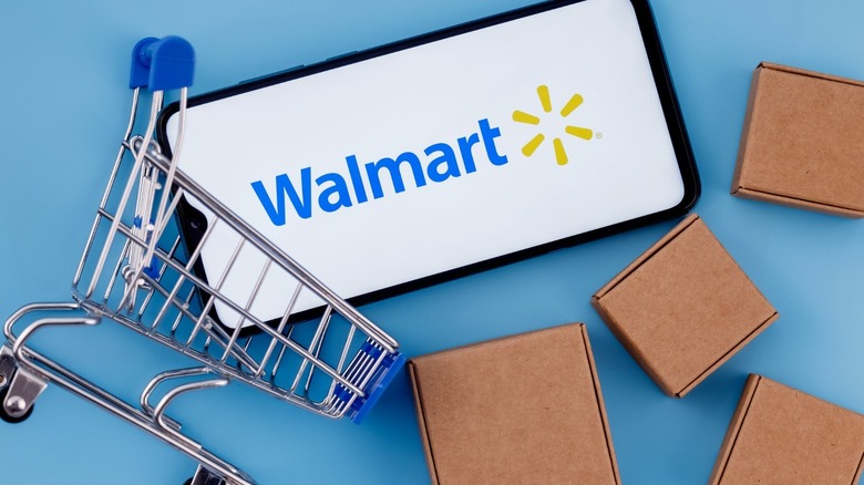 Walmart logo on phone with shopping cart
