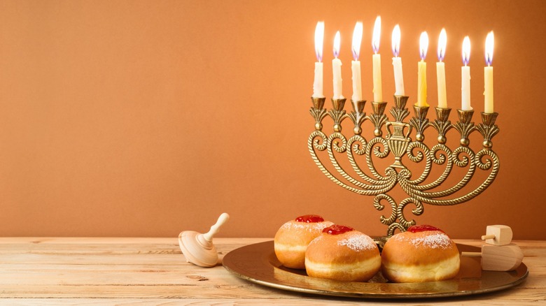 Jelly-filled sufganiyot and menorah