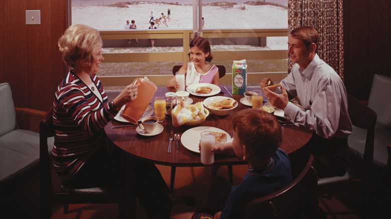 A 1960s image of a family eating breakfast around a table