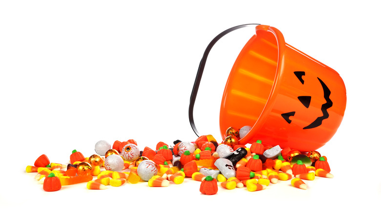 Halloween candy spilling from bucket