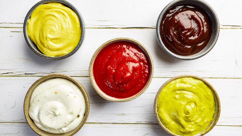 Various condiments in small bowls