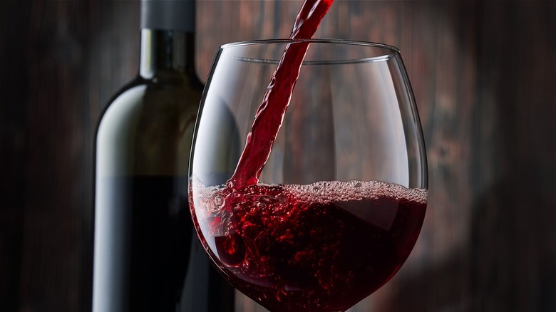 Red wine being poured into glass