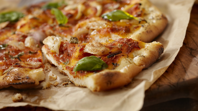 Slice of pizza with brown crust