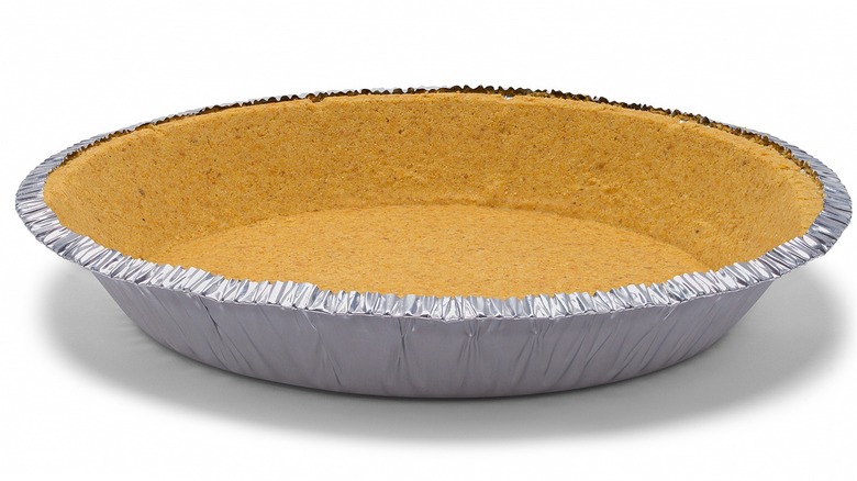 unfilled pie crust in metal tin
