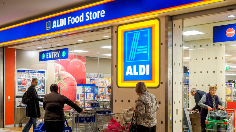 Customers with carts outside Aldi shop