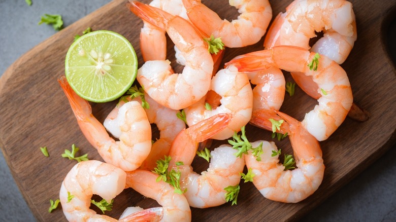 Cooked shrimp on cutting board