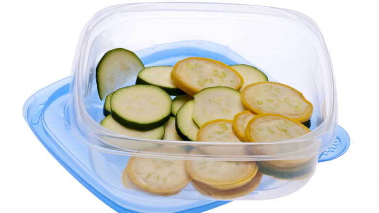 Cut-up zucchini in plastic container