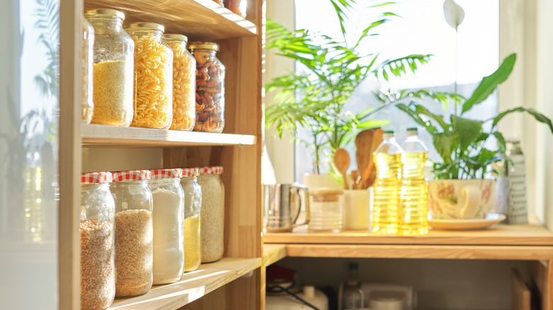 Dry goods in clear jars on shelves