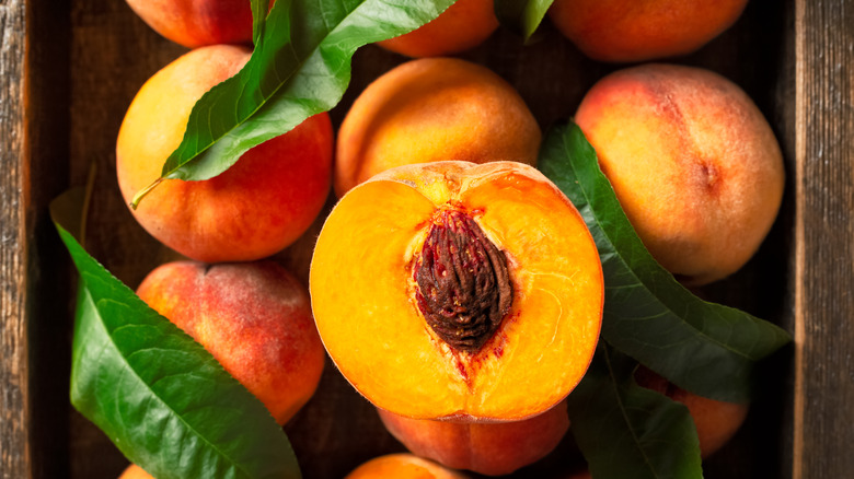 peaches in wooden crate