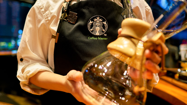 Starbucks logo sign outside glass window