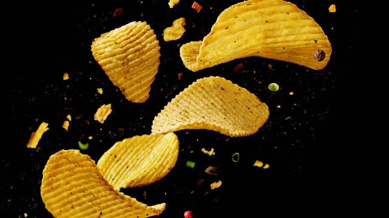 Potato chips on a black background