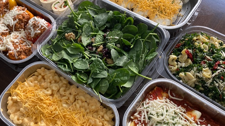 Assorted premade meals from Sam's Club on table.