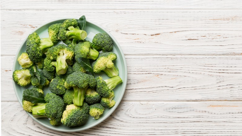 Broccoli florets on a white plate