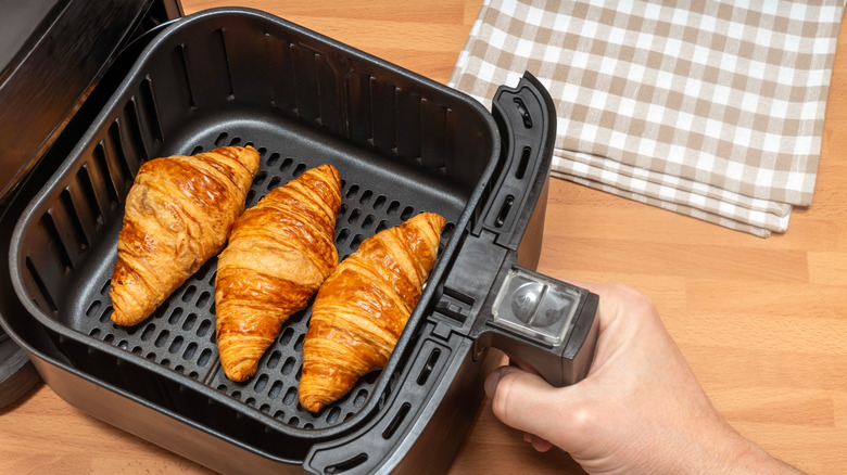 Croissants in basket of open air fryer