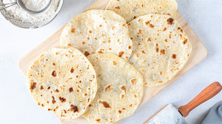 flour tortillas on cutting board