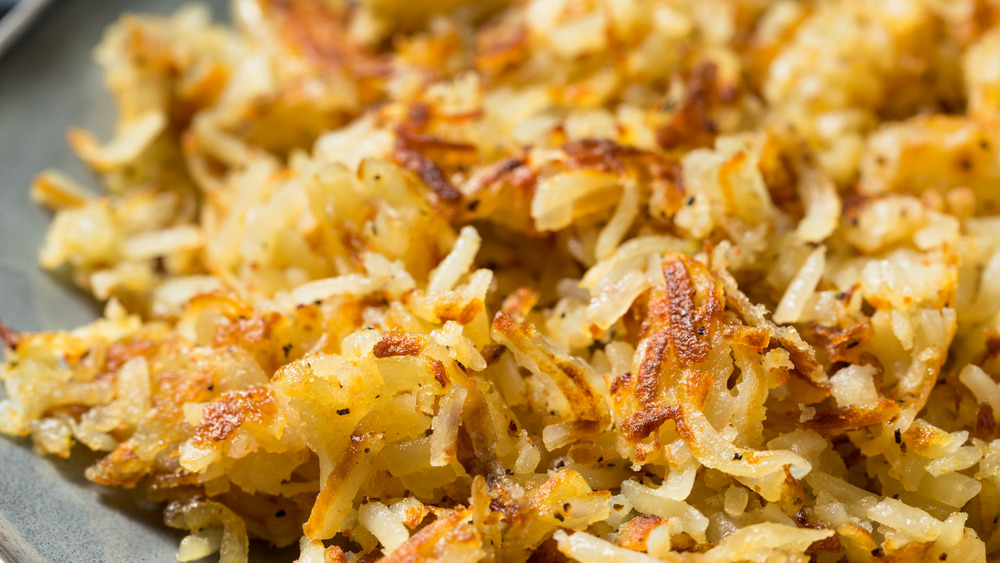 Cooked hash browns in a pan