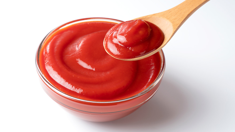 Ketchup in a bowl with a spoon