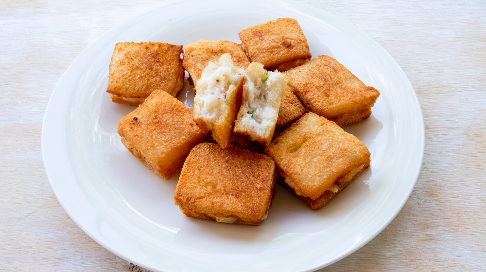 Square shrimp toast on white plate