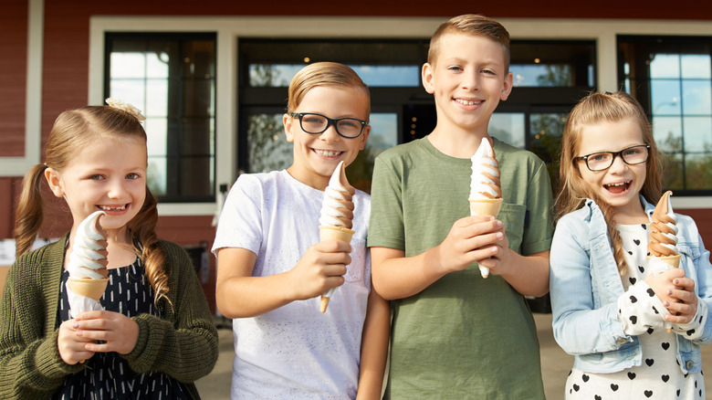 Four children eating soft serve