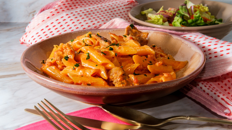 pasta with vodka sauce and salad