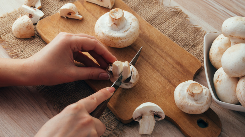 mushrooms being cut