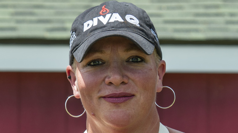 Danielle Bennett in hat and wearing earrings