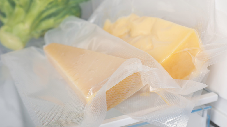 Blocks of cheese stored in fridge