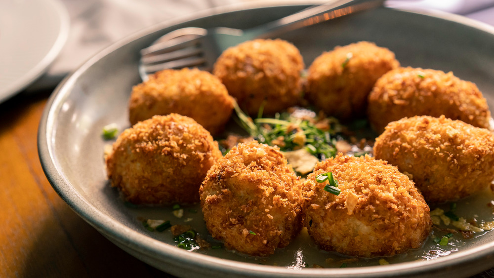 Croquettes with sauce on plate