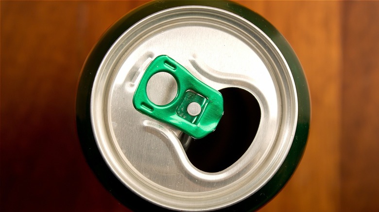 soda can with green pop tab