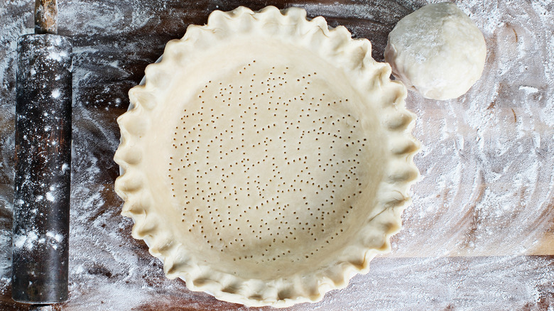 unbaked pie crust dough in pie plate