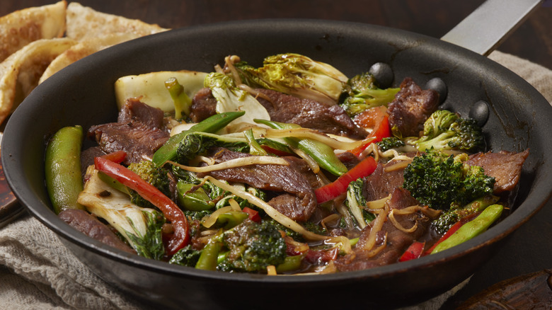 beef and vegetable stir-fry in pan