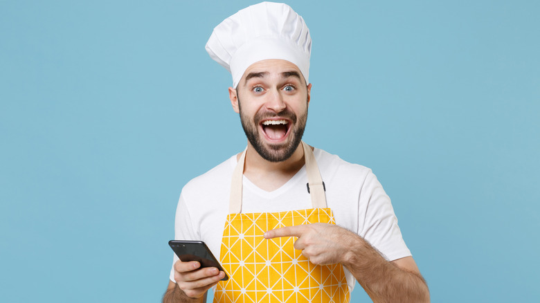 Chef holding a phone