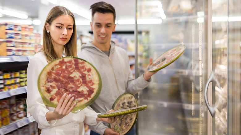 people buying frozen pizza