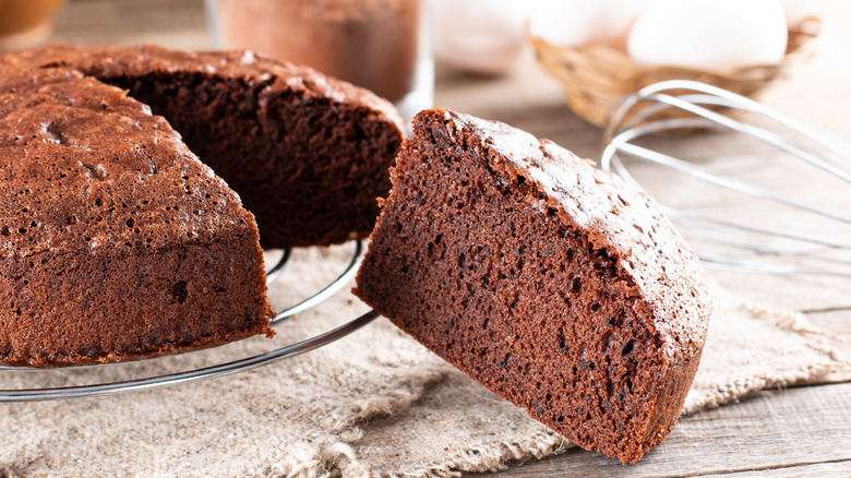 Chocolate cake with no frosting on a baker's rack