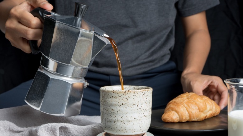 pouring coffee from Moka pot 