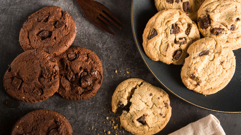 chocolate chip cookies on a countertop and plate