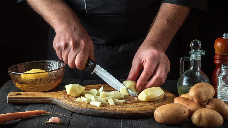 Chef uses knife to slice